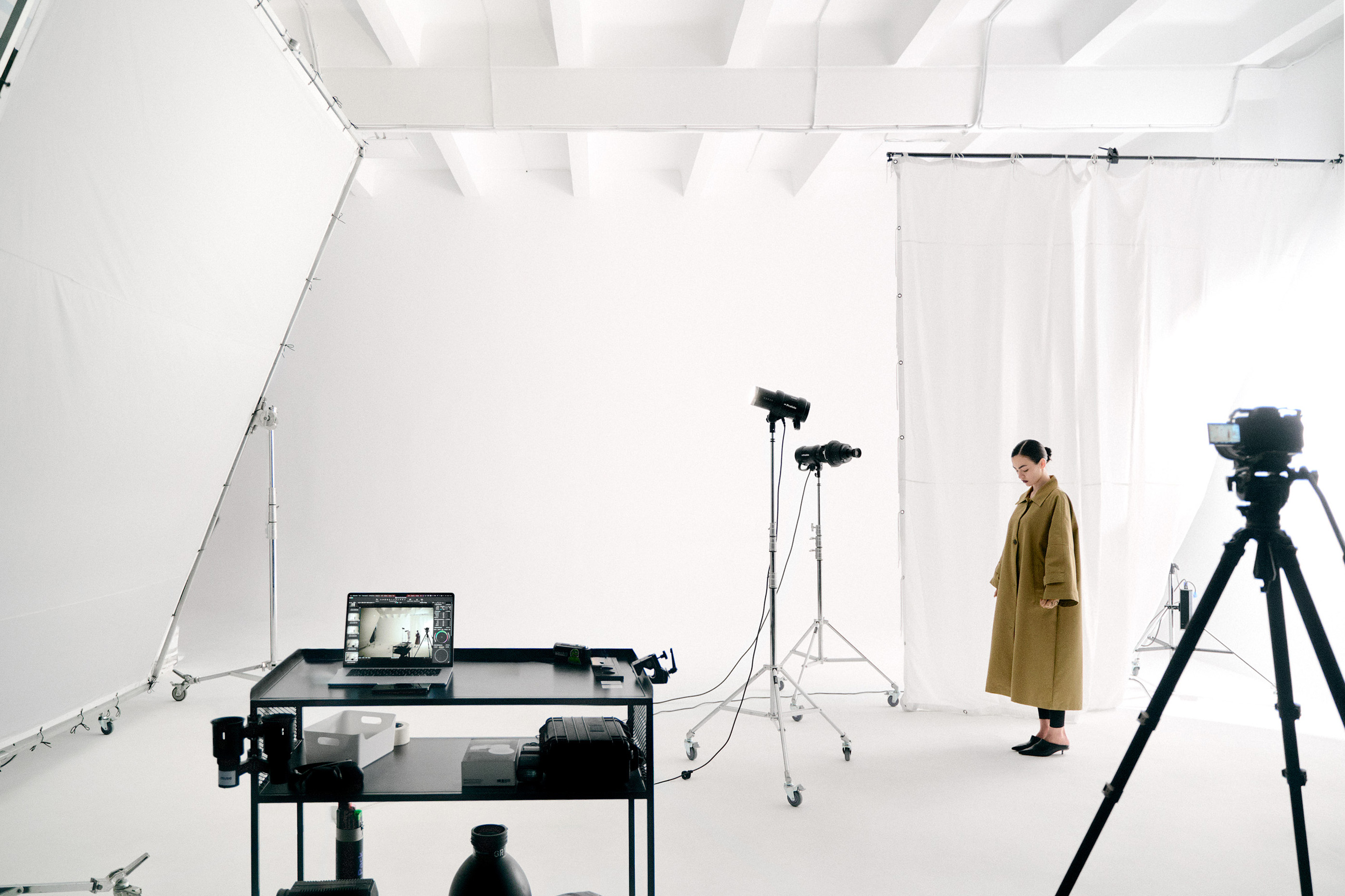 Photography assistant setting up equipment